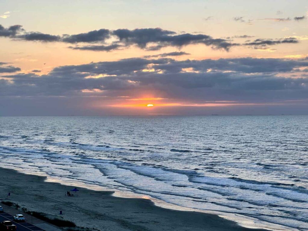 sunset over ocean in Galveston Island
