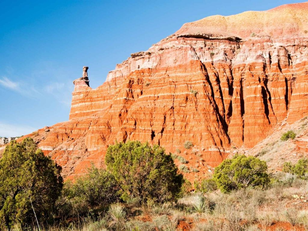 orange cliffs and desert terrain in Canyon, one of the Texas small towns