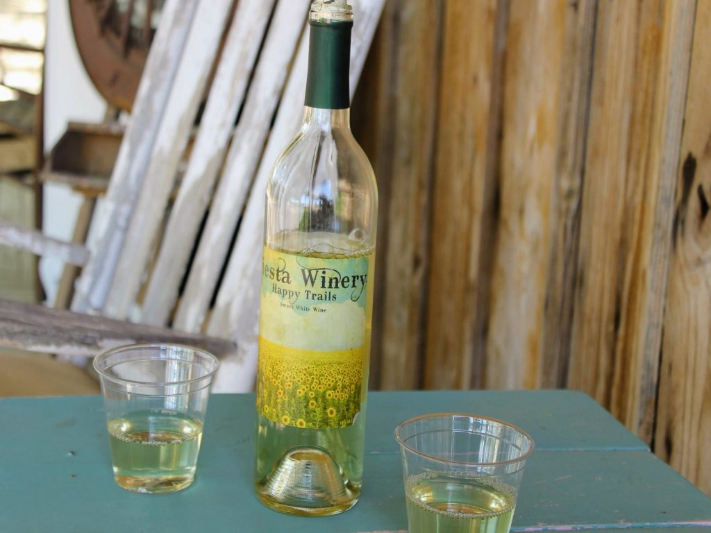 Bottle of wine with 2 glasses by it