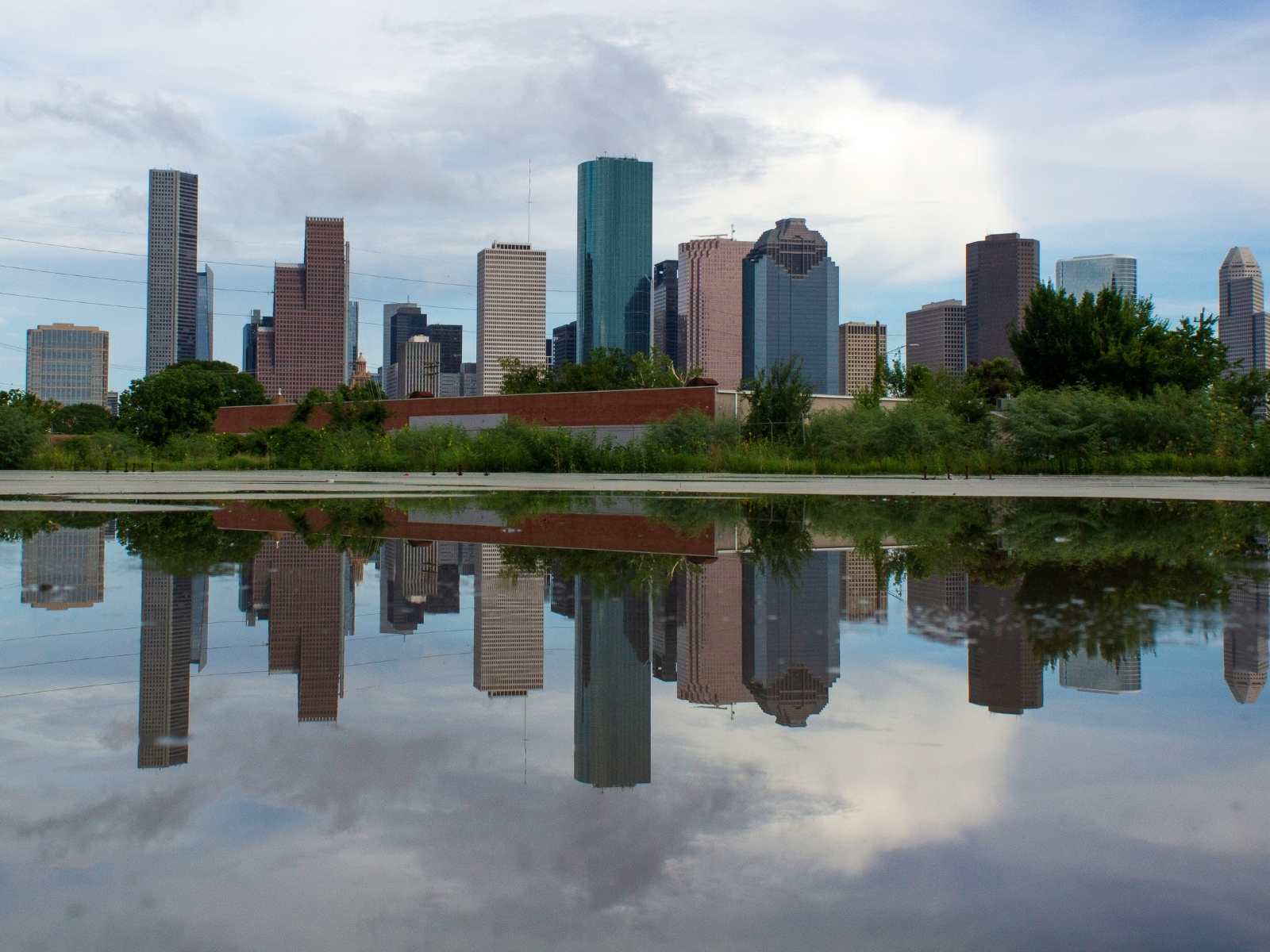 lake in front of the Houston skyline