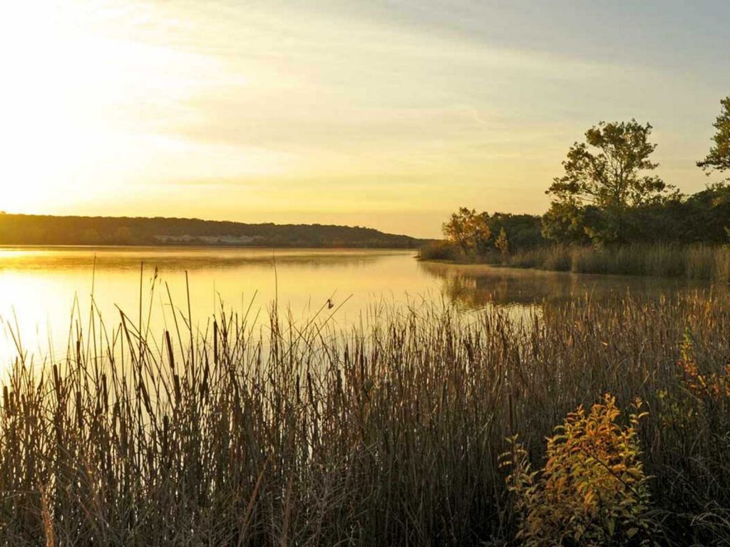 sunset over lake at Cleburne State Park-one of the state parks near Dallas