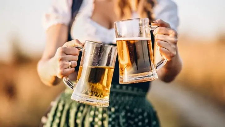girl carrying two beer at Oktoberfest